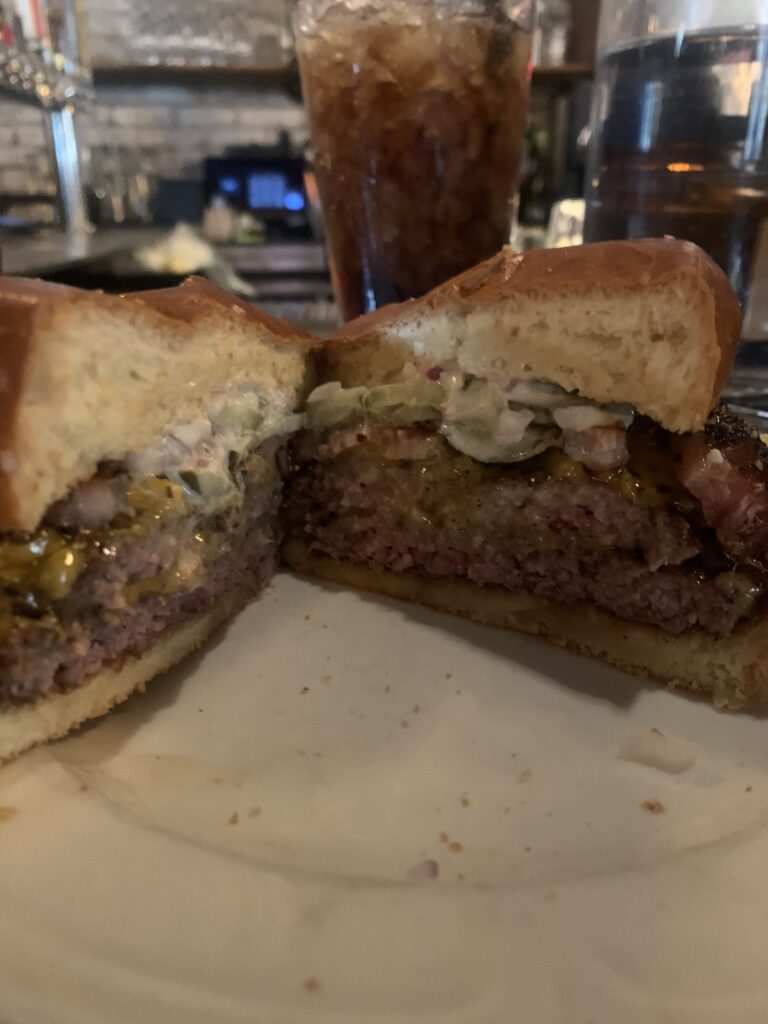 Inside of the single cheeseburger with bacon