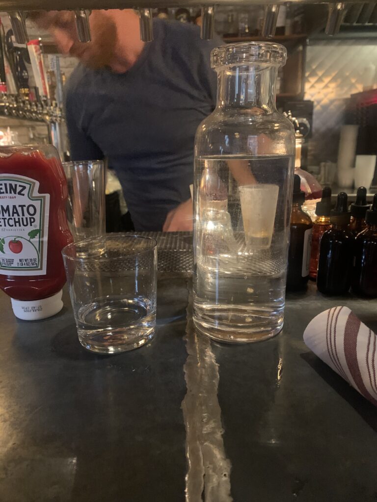 Bottle of tap water served during sit down.