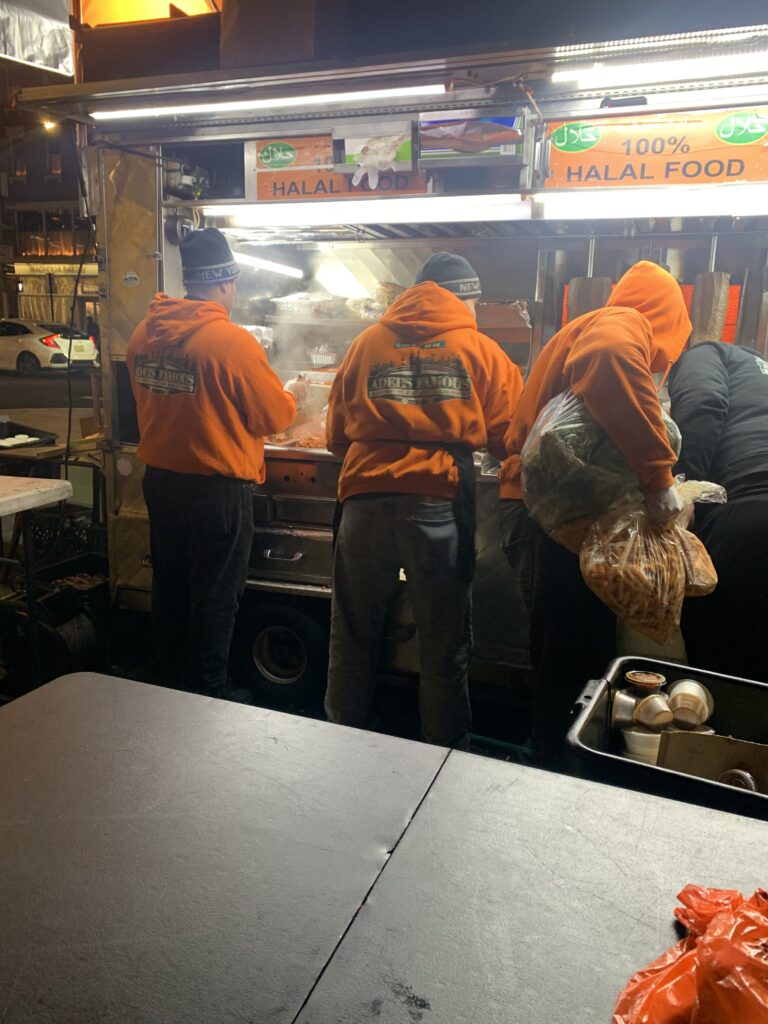 Adel's Famous Halal Food - Staff members working