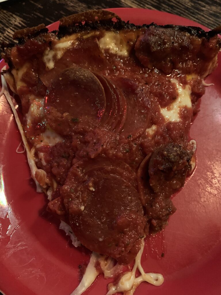 Pequod's Pizza - Pepperoni and Sausage slice - close up