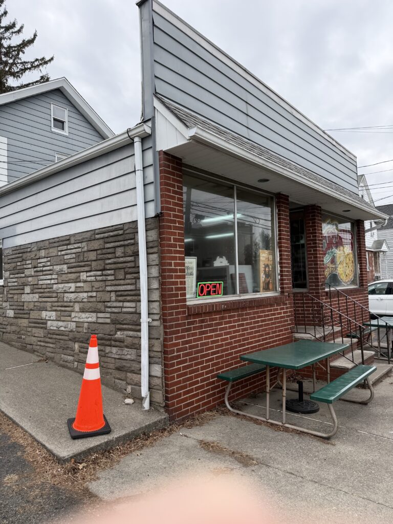 Storefront of Curioni's Pizza