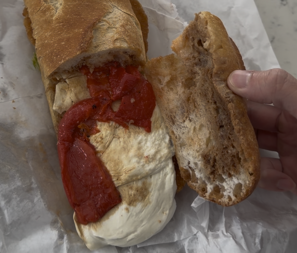 Cosmo's Italian Salumeria - inside of breaded chicken mozz red peppers