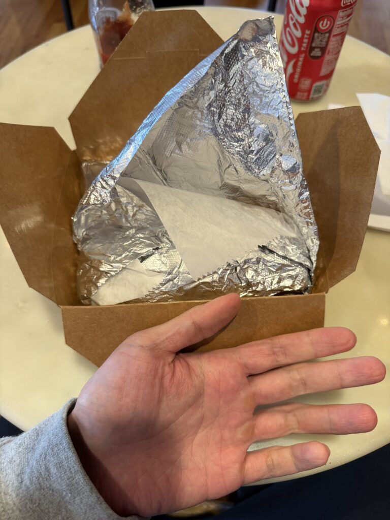 Senatore Sandwiches - Hand size comparison with cheesesteak