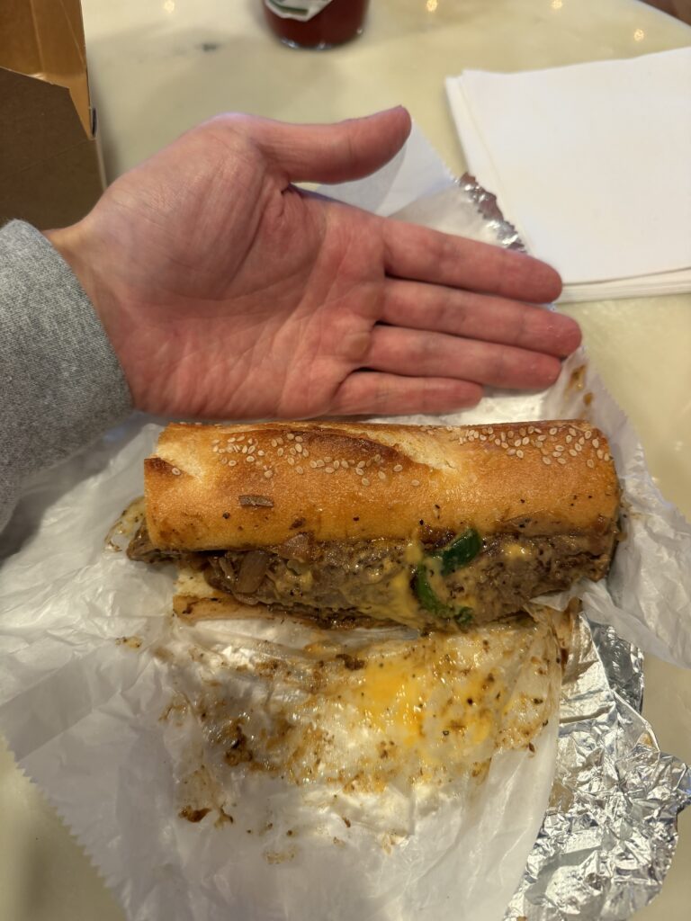 Senatore Sandwiches - hand size comparison cheesesteak