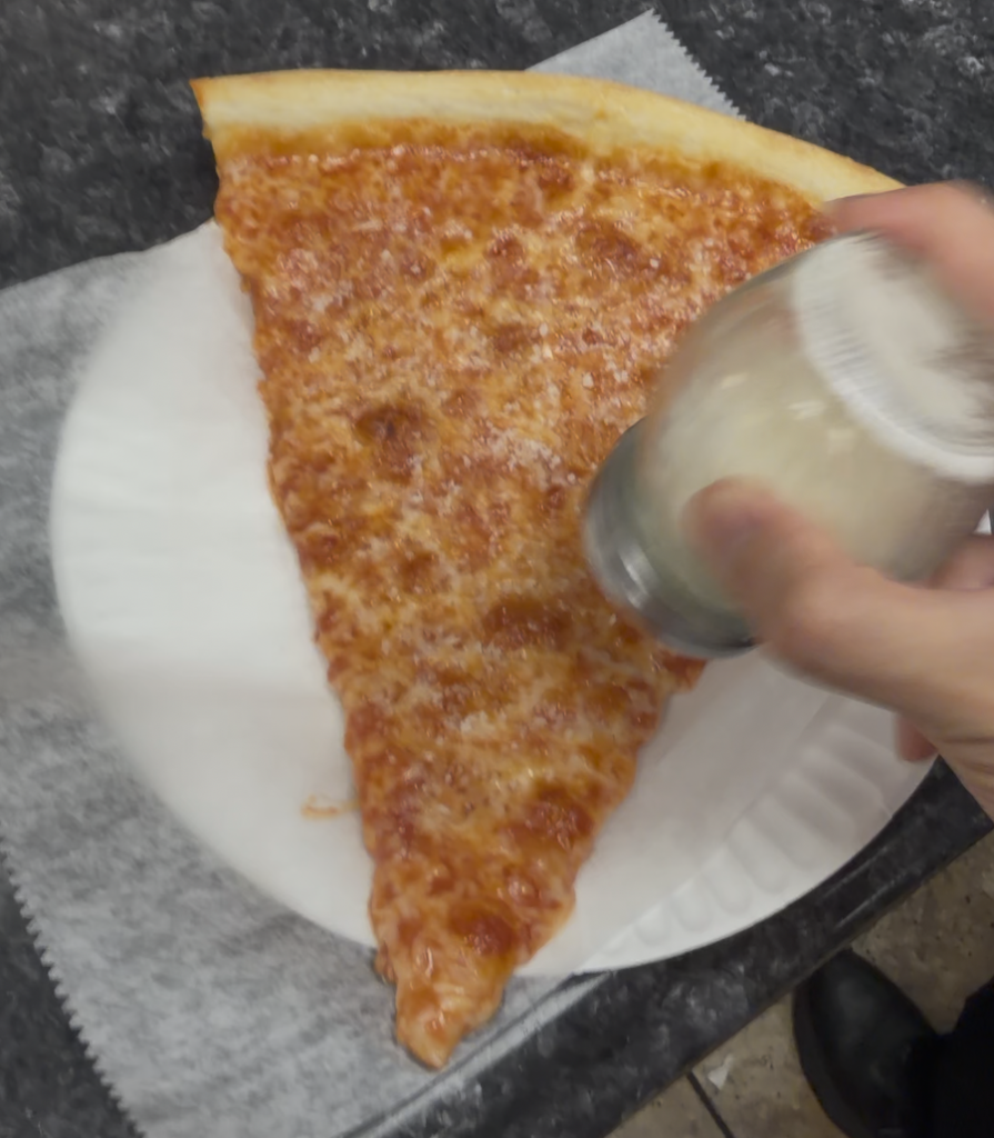 Lucia Pizza - puting parm on Slice