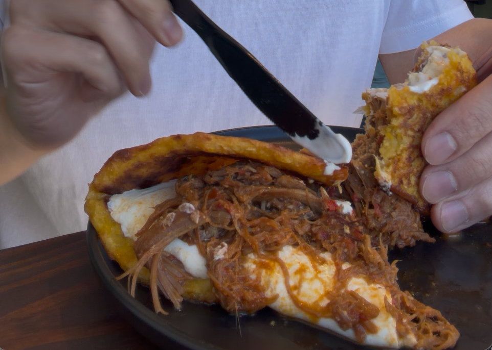 Santo Cafe - cachapa mechada spreading sour cream